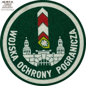 1. Nazwa własna: naszywka organizacyjna Lubuskiej Brygady  Wojsk Ochrony Pogranicza
2. Charakterystyka przedmiotu: okrągła plakietka (o średnicy 6,6 cm)  wykonana z filcu na podkładzie płóciennym. Obwiedziona białym paskiem,  w dolnej części półkoliście napis „Wojska Ochrony Pogranicza”. W centrum pola logo jednostki organizacyjnej – herb Zielonej Góry na tle słupa  granicznego. Noszona na prawym przedramieniu marynarki i płaszcza munduru wyjściowego
3. Czas powstania: lata 80. XX w.
4. Hasła przedmiotowe: Wojska Ochrony Pogranicza, umundurowanie
5. Miejsce przechowywania/właściciel: Śląski Oddział Straży Granicznej  w Raciborzu